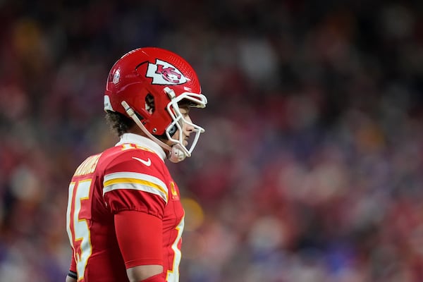 Kansas City Chiefs quarterback Patrick Mahomes (15) celebrates his touchdown against the Buffalo Bills during the first half of the AFC Championship NFL football game, Sunday, Jan. 26, 2025, in Kansas City, Mo. (AP Photo/Ashley Landis)