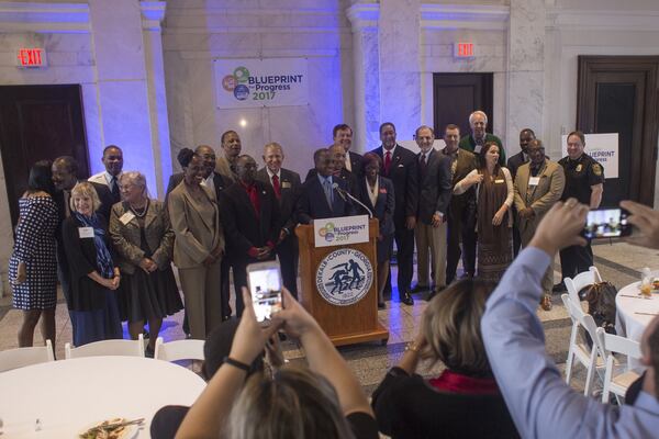 Officials pose for a picture at the start of a press conference at the Old DeKalb County Courthouse in Decatur, Ga., on Wednesday, Nov. 8, 2017. On Election Day, citizens overwhelmingly supported a sales tax increase. (CASEY SYKES, CASEY.SYKES@AJC.COM)