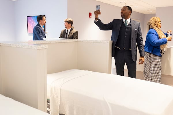 Mayor Andre Dickens shoots video of the bunk area following a ceremony to open Atlanta’s new Center for Diversion and Services on Monday, Oct. 28, 2024, following a ribbon cutting ceremony. Ben Gray for the Atlanta Journal-Constitution