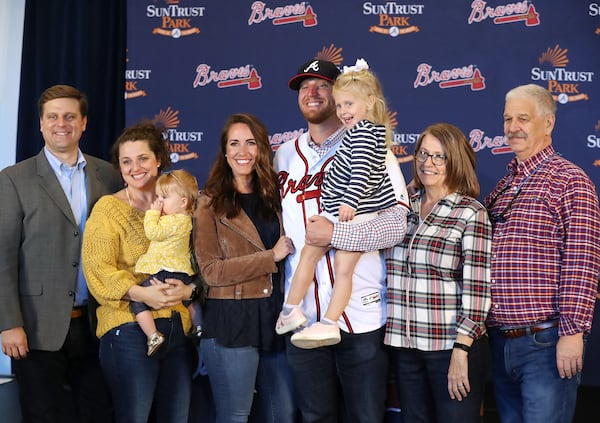 Braves pitcher Will Smith poses  with his parents Kay and Charles Smith (right), his fiancee Taylor Dunagan (to Smith's right) and his sister Charlie Bass (far left), with her husband David and their children Laney, 3, and Libby, 10-months.   Curtis Compton/ccompton@ajc.com