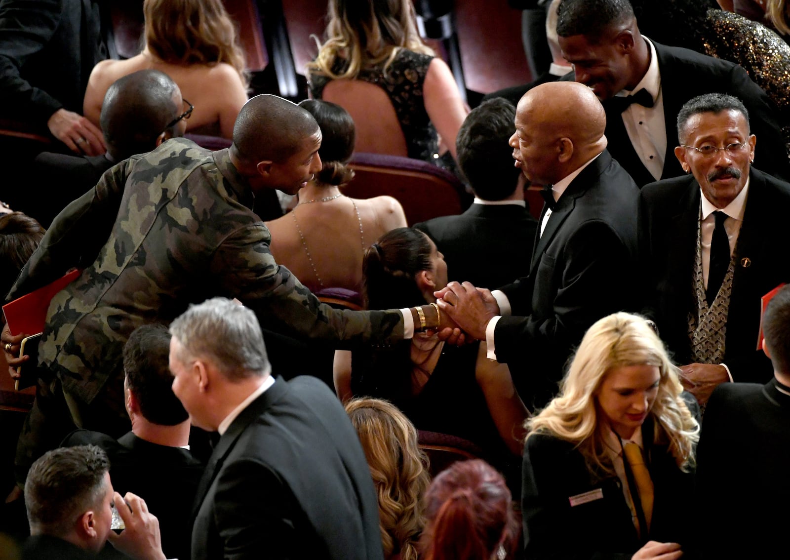 Pharrell Williams (left) and U.S. Rep.John Lewis greet each other at the 91st Annual Academy Awards at Dolby Theatre on Sunday, February 24, 2019, in Hollywood, California. (Photo by Kevin Winter/Getty Images)