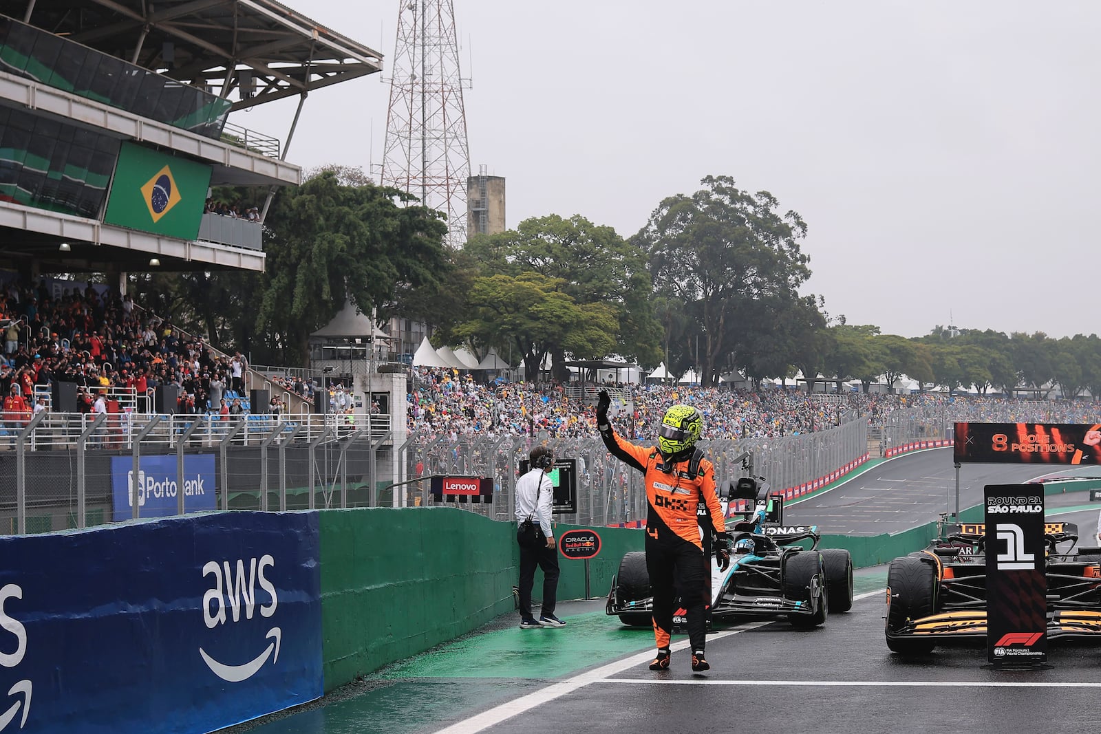 Pole position winner, McLaren driver Lando Norris of Britain, celebrates after the qualifying session ahead of the Brazilian Formula One Grand Prix at the Interlagos race track, in Sao Paulo, Brazil, Sunday, Nov. 3, 2024. (AP Photo/Ettore Chiereguini)