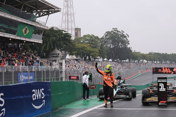 Pole position winner, McLaren driver Lando Norris of Britain, celebrates after the qualifying session ahead of the Brazilian Formula One Grand Prix at the Interlagos race track, in Sao Paulo, Brazil, Sunday, Nov. 3, 2024. (AP Photo/Ettore Chiereguini)