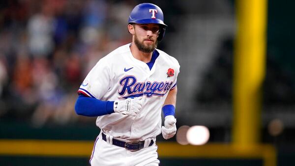 Texas Rangers center fielder Eli White rounds the bases during a baseball game against the Tampa Bay Rays, Monday, May 30, 2022, in Arlington, Texas. (AP Photo/Tony Gutierrez)