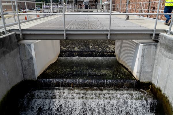 Treated water leaves the facility bound for the Chattahoochee River. Fulton County officials tour the new water reclamation facility built on the grouds of the existing Big Creek Wastewater Treament center. Thursday, August 22, 2024 (Ben Hendren for the Atlanta Journal-Constitution)