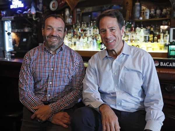 Kent Alexander (right) and Kevin Salwen, co-authors of “The Suspect,” a new book about Richard Jewell, during an event at Manuel’s Tavern in Atlanta. (Bob Andres / robert.andres@ajc.com)