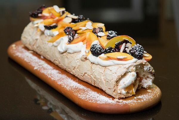 The super popular Brit-Israeli chef comes to the test kitchen with his recipe developer to make a fruit Pavlova (meringue and cream dessert) from their new cookbook. (Myung J. Chun / Los Angeles Times/TNS)