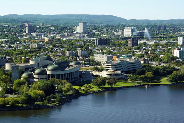 The architecture of Ottawa on display along the Ottaoutais River.