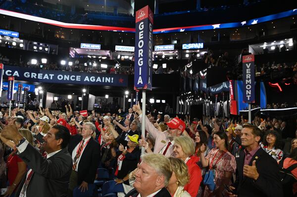 Georgia delegates cheer during the first day of the Republican National Convention in Milwaukee.