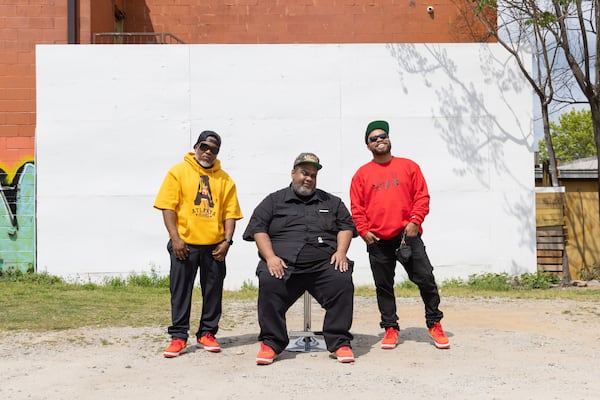 (L-R) Atlanta Influences Everything founders Tory Edwards, Ian Ford and Bem Joiner pose in front of their mural in Atlanta on Tuesday, April 2, 2024. (Arvin Temkar / arvin.temkar@ajc.com)