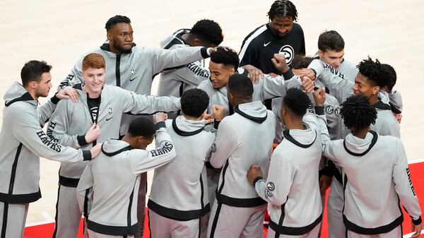 Atlanta Hawks huddle during the first half against the Orlando Magic Sunday, Dec. 13, 2020, in Atlanta. (John Bazemore/AP)