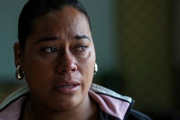 Larissa Martinez, who was deported from the U.S. in 2021 with her three children, reacts during an interview in San Pedro Sula, Honduras, Wednesday, Dec. 4, 2024. (AP Photo/Moises Castillo)