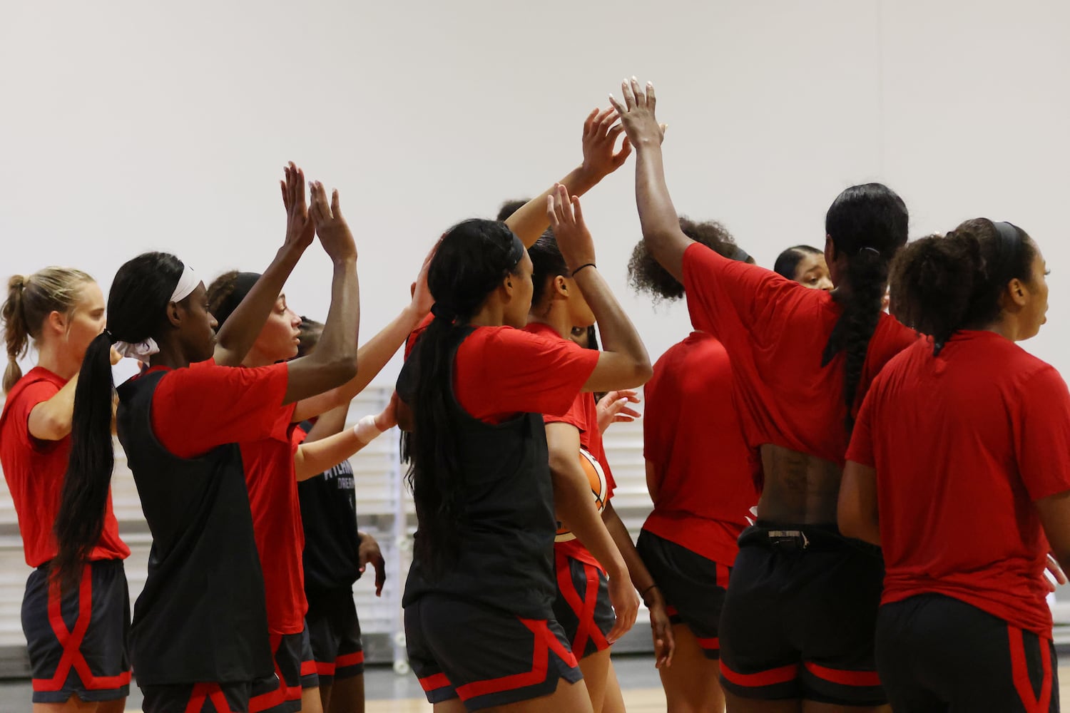 Atlanta Dream players high five after the practice finished at Atlanta dream training camp on Monday, April 18, 2022. Miguel Martinez/miguel.martinezjimenez@ajc.com