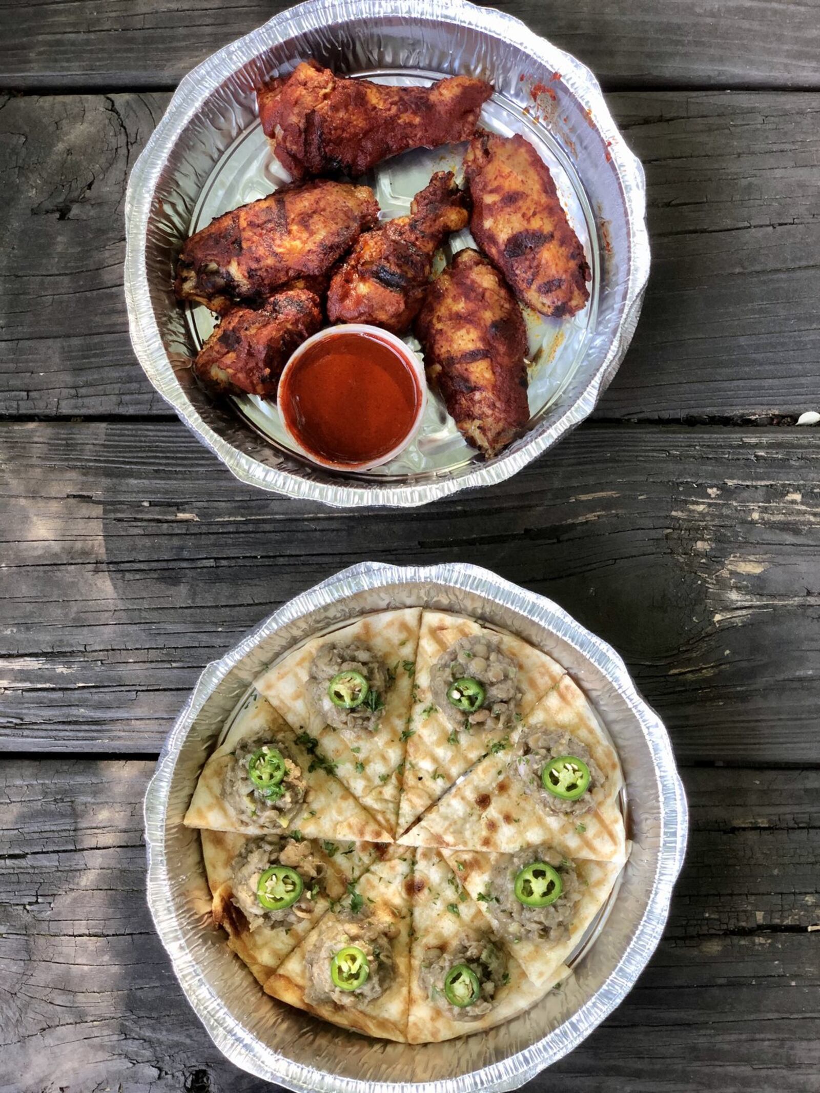 The awaze wings and azifah (cold brown lentil salad) on pita are terrific starters at Feedel Bistro. CONTRIBUTED BY WENDELL BROCK