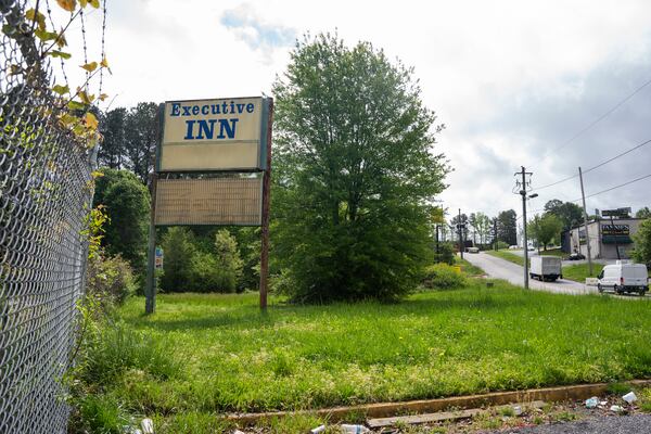 An abandoned hotel deteriorates on land that was recently purchased by the county for redevelopment along Fulton Industrial Blvd in Atlanta, Georgia on Thursday, April 11, 2024. (Olivia Bowdoin for the AJC).