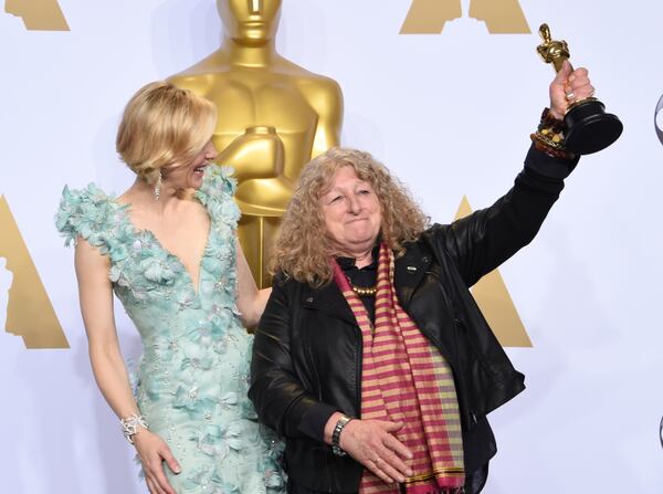 Actress Cate Blanchett (L) watches as Jenny Beavan celebrates with her Oscar for Best Costume Design, "Mad Max: Fury Road," in the press room during the 88th Oscars in Hollywood on February 28, 2016. AFP PHOTO/FREDERIC J. BROWN / AFP / FREDERIC J. BROWN