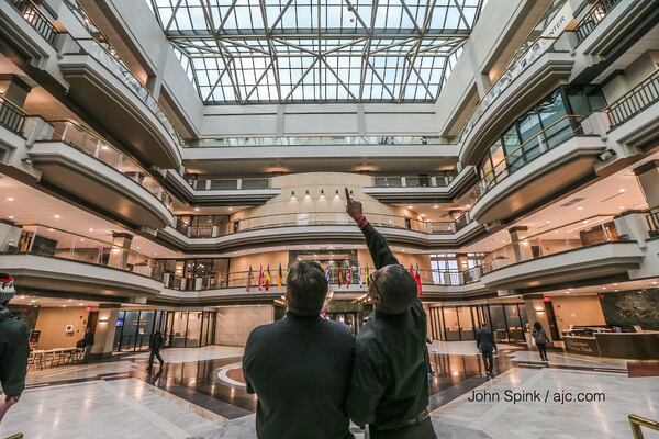 Employees at Atlanta City Hall are being handed instructions as they come through the front doors to not turn on computers or log on to their workstations. JOHN SPINK / AJC