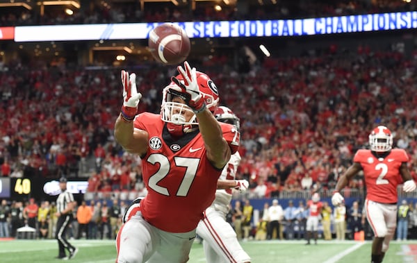 Georgia defensive back Eric Stokes (27) is not able to complete the interception during the second half of the SEC Championship game against the Alabama Crimson Tide on Saturday, Dec. 1, 2018, at Mercedes-Benz Stadium in Atlanta. Alabama won 35-28. (Hyosub Shin / hshin@ajc.com)