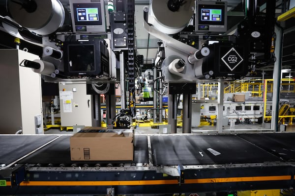 An automated machine is seen placing a sticker on an Amazon package at the Amazon Distribution Center in Stone Mountain on Monday, December 2, 2024, as the center works to fulfill thousands of orders made on Cyber Monday.
(Miguel Martinez / AJC)