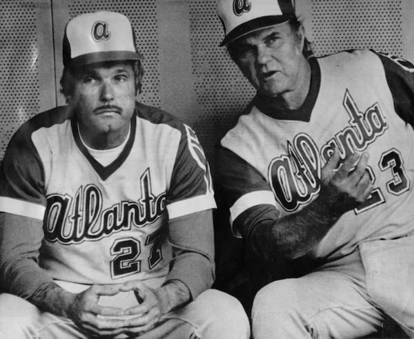 1977: Braves owner Ted Turner (left) decided he could do better than his manager and donned a uniform for this game. Here he is with pitching coach Johnny Sain in the dugout. (AP Photo)