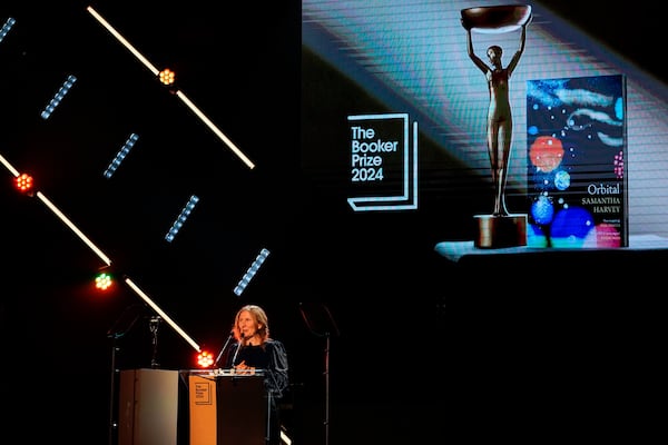 Samantha Harvey speaks on stage after winning the Booker Prize award 2024, in London, Tuesday, Nov. 12, 2024. (AP Photo/Alberto Pezzali)