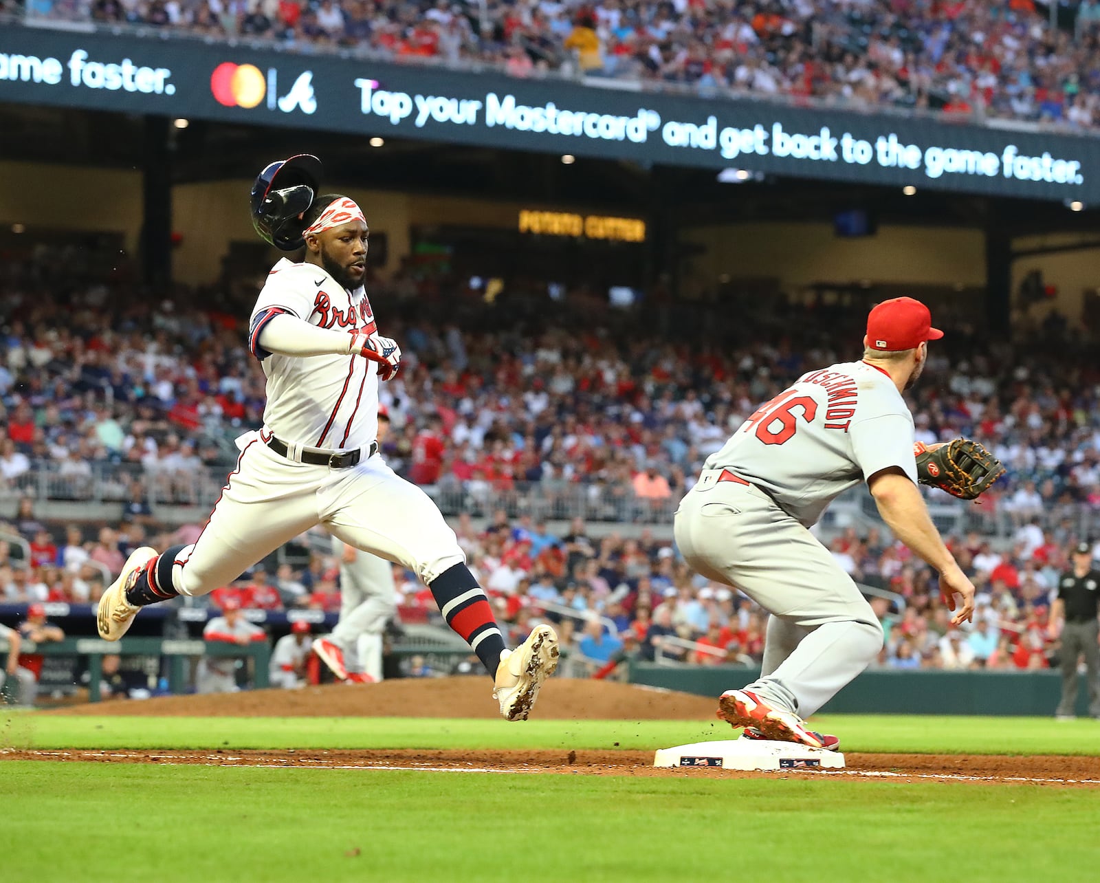 Braves outfielder Michael Harris beats the throw to St. Louis Cardinals first baseman Paul Goldschmidt for a single during the fourth inning in a MLB baseball game on Tuesday, July 5, 2022, in Atlanta.  “Curtis Compton / Curtis.Compton@ajc.com”