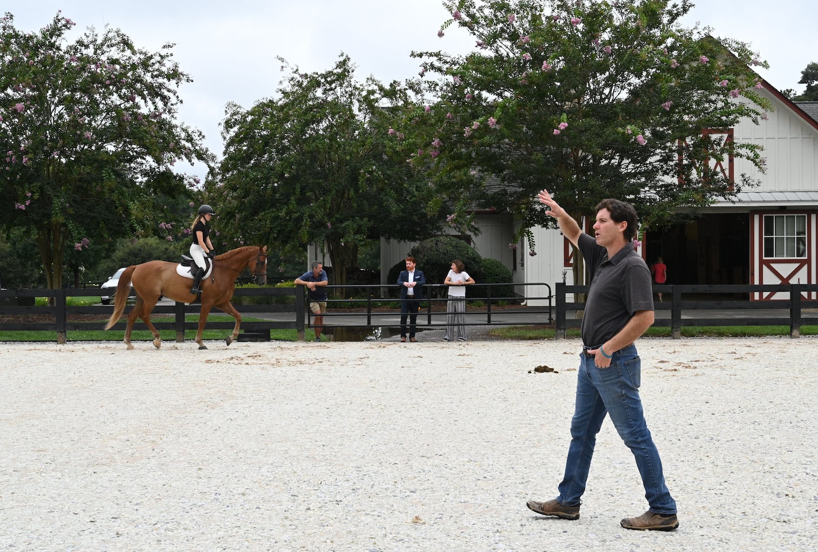 Trainer Daniel Pizarro (foreground) instructs at Hester’s horse farm home in Milton.  (Hyosub Shin / Hyosub.Shin@ajc.com)