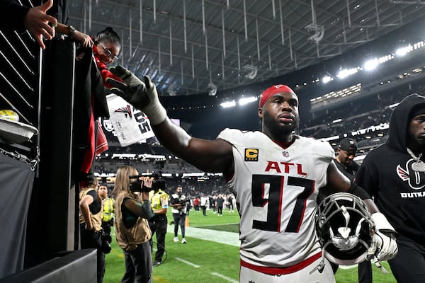 Atlanta Falcons defensive end Grady Jarrett (97) greets fans after an NFL football game against the Las Vegas Raiders, Monday, Dec. 16, 2024, in Las Vegas. (AP Photo/David Becker)