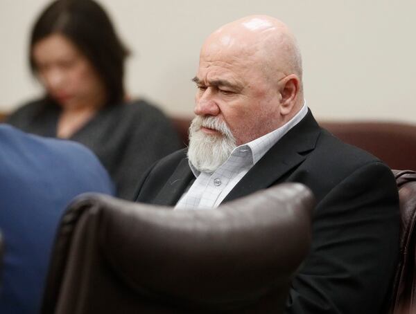 Franklin Gebhardt listens to testimony on Thursday.  Gebhardt, 60, is charged with felony murder and other counts in what prosecutors say was a racially motivated killing that occured in 1983 in Spalding County.    BOB ANDRES  /BANDRES@AJC.COM