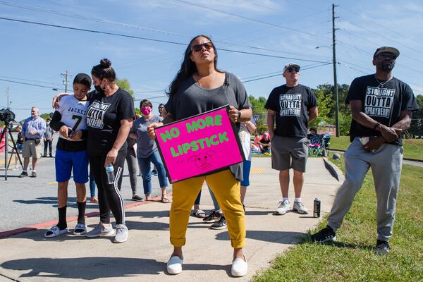 (Left to right) Zion Smith, Milady Smith, Jessica Pedraza, Jack Rollins and Ramsey Smith listen to Cobb County school board member Randy Scamihorn answer questions during a rally at Sprayberry High School on Sunday, April 18, 2021, in Marietta, Georgia. Parents and community members held the rally to encourage Cobb County school board members to allocate funds to renovate the school. CHRISTINA MATACOTTA FOR THE ATLANTA JOURNAL-CONSTITUTION 