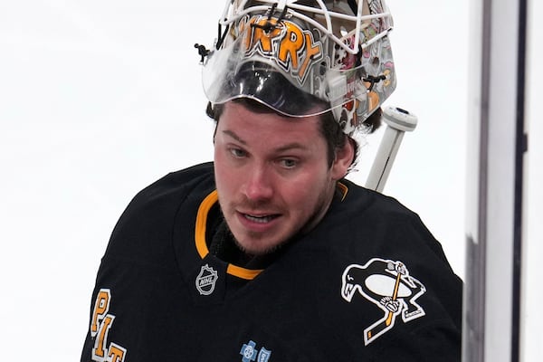 Pittsburgh Penguins goaltender Tristan Jarry takes a timeout during the first period of an NHL hockey game against the Vegas Golden Knights in Pittsburgh, Tuesday, March 11, 2025. (AP Photo/Gene J. Puskar)