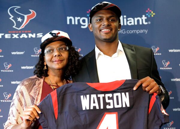 Quarterback Deshaun Watson, right, poses with his mother, Deann, after a Houston Texans news conference Friday, April 28, 2017, in Houston. The Texans drafted Watson in the first round of the 2017 NFL Draft. (AP Photo/David J. Phillip)