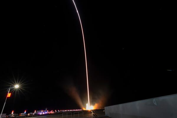 In this image taken with a long exposure, a Long March rocket with a Shenzhou-19 spacecraft atop takes off from the Jiuquan Satellite Launch Center in Jiuquan, northwestern China in the early hours of Wednesday, Oct. 30, 2024. (AP Photo/Ng Han Guan)