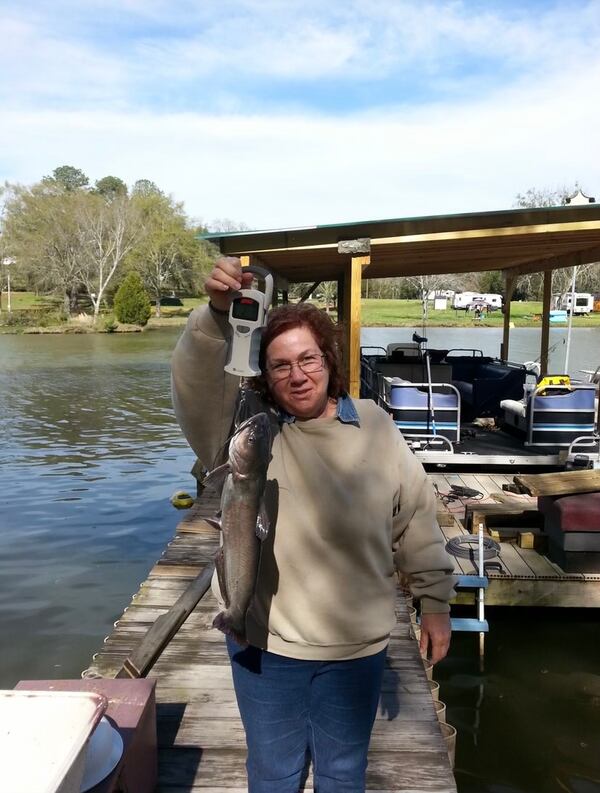 At their camper on Lake Weiss in Alabama, Sandra loved being out on the water fishing, but her husband Ray recounted that he always had to take the fish off the hook for her.