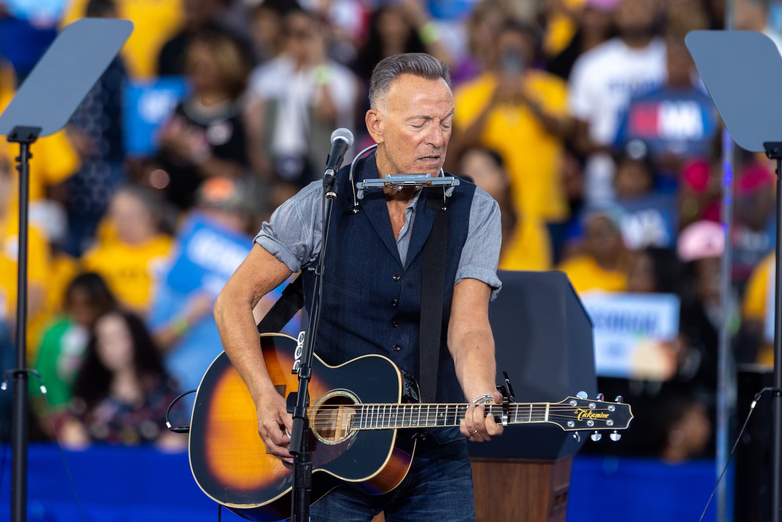 Bruce Springsteen plays during Democratic presidential nominee Kamala Harris’ rally at James R. Hallford Stadium.