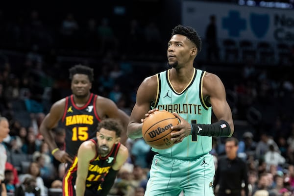 Charlotte Hornets forward Brandon Miller shoots a free throw during the first half of an NBA basketball game against the Atlanta Hawks, Saturday, Nov. 30, 2024, in Charlotte, N.C. (AP Photo/Matt Kelley)