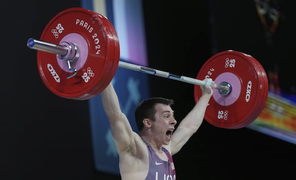 Marietta native Hampton Morris during the men's 61kg weightlifting event.