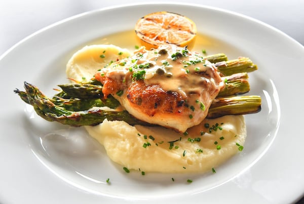 N.C. Stuffed Flounder, crab, grilled asparagus, garlic whipped potato, caper beurre blanc. CONTRIBUTED BY CHRIS HUNT PHOTOGRAPHY