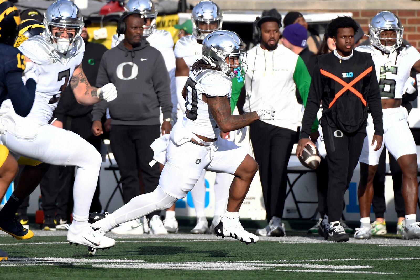 Oregon running back Jordan James, right, rushes against Michigan in the first half of an NCAA college football game, Saturday, Nov. 2, 2024, in Ann Arbor, Mich. (AP Photo/Jose Juarez)