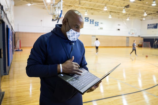 Coach Keith Legree’s first team finished 19-4. The Blue Devils, playing without three top players because of COVID-19 protocols, were knocked out of the state playoffs in the first round. Legree says that Coach Hill's competitive spirit lives on in the team. “The way I learned the game of basketball was through Coach Hill,” he said. (AJC Photo/Stephen B. Morton)