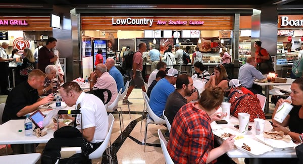 Travelers fill the dining area on Concourse A beside the Low Country restaurant at Hartsfield-Jackson International Airport on Sept 26, 2018, in Atlanta. (Curtis Compton/ccompton@ajc.com)