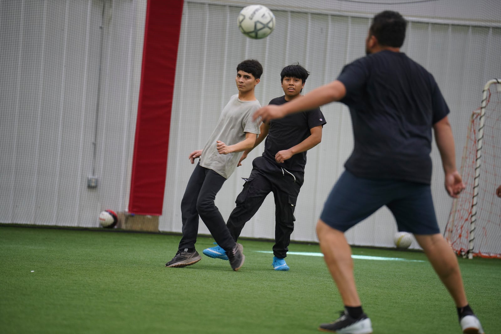 Community members play a game of soccer in the JBS Fieldhouse in Worthington, Minn., on Monday, Oct. 21, 2024. (AP Photo/Jessie Wardarski)