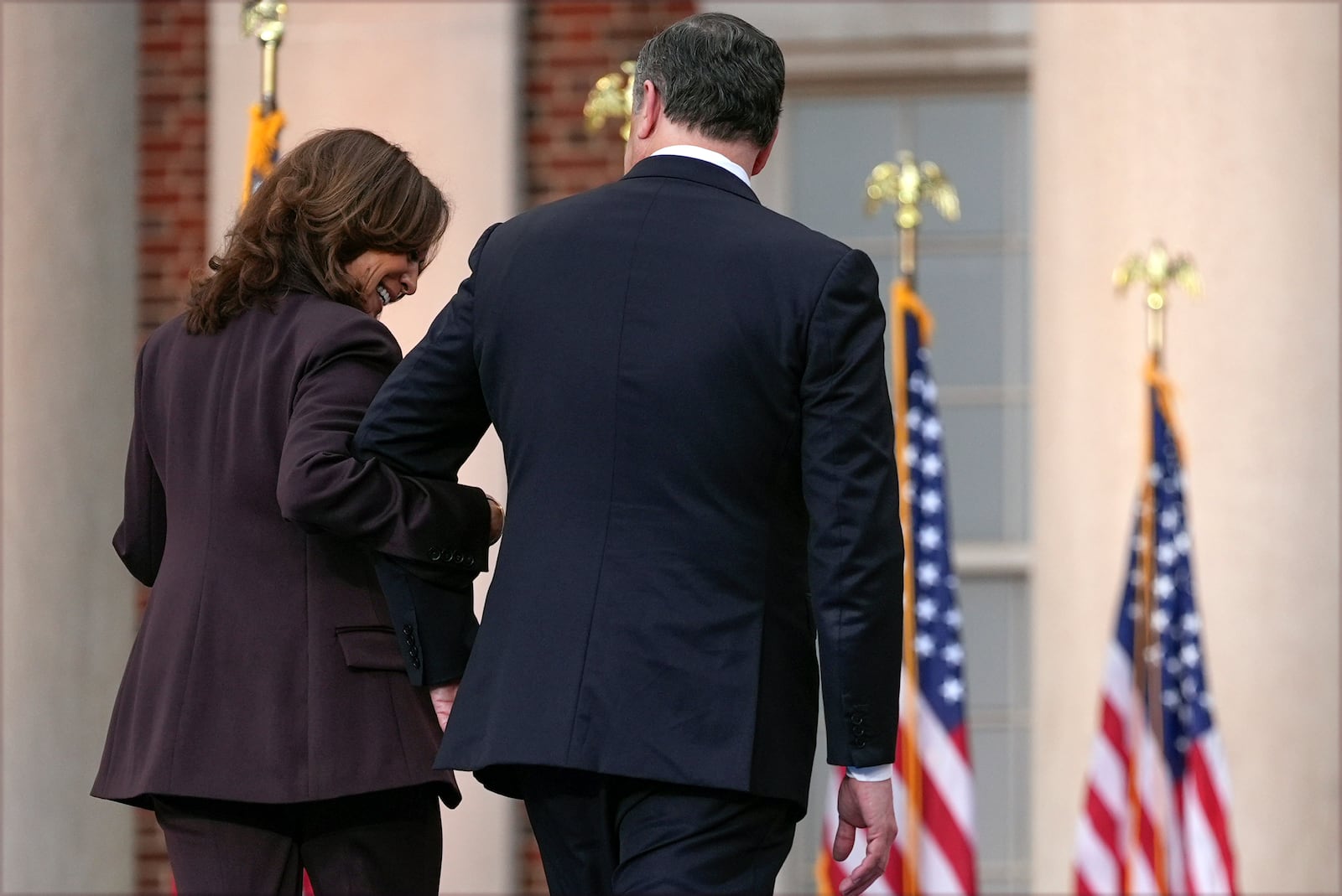 Vice President Kamala Harris (left) and second gentleman Doug Emhoff depart after a concession speech in the 2024 presidential election on Wednesday, Nov. 6, 2024, on the campus of Howard University in Washington, D.C. (Jacquelyn Martin/AP)