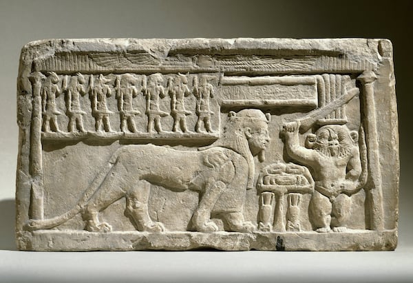 “Stela with the Gods Bes and Tutu” in limestone from 332-30 B.C. is featured in the Michael C. Carlos Museum exhibition “Divine Felines: Cats of Ancient Egypt.” CONTRIBUTED BY BROOKLYN MUSEUM