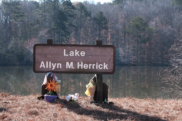 Fresh flowers were left at the Lake Herrick sign by the intramural fields on the University of Georgia's campus in Athens, Georgia on Saturday, Feb. 22, 2025 to mark the one-year anniversary of the death of nursing student Laken Riley, the first homicide on campus in more than two decades.
(Nell Carroll for The Atlanta Journal-Constitution).