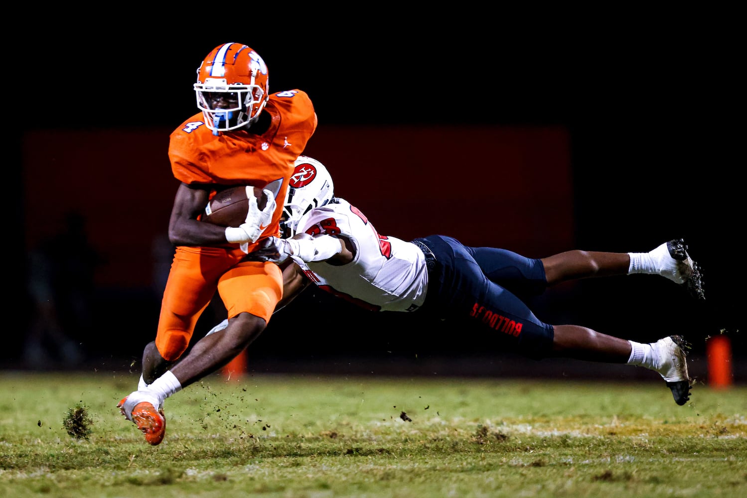 Parkview wide receiver Mike Matthews (4) runs the ball as North Gwinnett safety Christian Smith (28) dives to bring him down during a GHSA 7A high school football game between the North Gwinnett Bulldogs and the Parkview Panthers at Parkview High School in Lilburn, Ga., on Friday, Sept. 3, 2021. (Casey Sykes for The Atlanta Journal-Constitution)