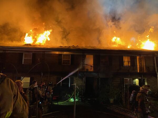 Flames spewed from the top of the building and damaged multiple units.