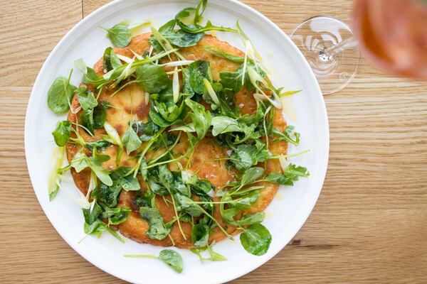 Redbird chickpea flatbread with garlic jam, olive oil, and orange. Photo credit- Mia Yakel.