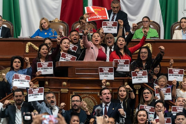 FILE - Legislators rally in favor of judicial reform at Congress, in Mexico City, Sept. 12, 2024. (AP Photo/Felix Marquez)