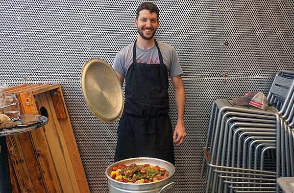 Dane Gauthier takes a moment from boiling crawfish for a picture at the Reddit meetup.